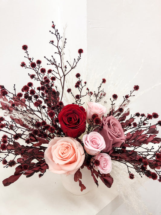 Suprise your partner with this small Valentine's Day Flower Arrangement featuring a half dozen roses by Newcastle Dried Flower Co.